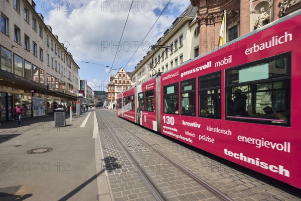 Tram, overhead lines, tram tracks, city center, pedestrian zone, general architecture, residential and commercial buildings, blue sky, cumulus clouds, Kürschnerhof street, Würzburg, Lower Franconia, district-free city, Bavaria, Germany