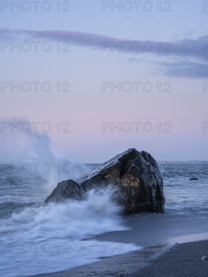 Okarito Beach, rocks, ocean, sandy beach. In the evening. long exposure. Westland Tai Poutini National Park, West Coast, South Island, New Zealand