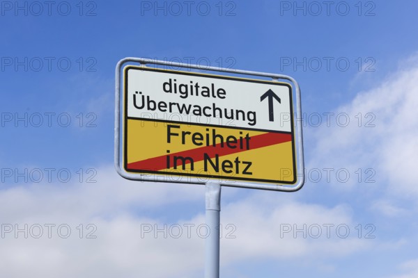 (photo montage) Exit sign with the text FREEDOM ON THE NET and DIGITAL SURVEILLANCE against a blue sky