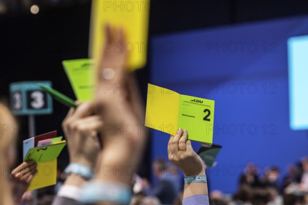 Stuttgart, Baden-Württemberg, 38th Federal Party Congress of the CDU of Germany in Stuttgart. Reelection of party leader Friedrich Merz. Due to technical problems with electronic voting, ballot papers and mobile ballot boxes were used. Merz was 91