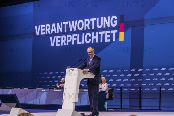 38th party congress of the CDU of Germany in Stuttgart. Merz in the lectern and party conference motto committed to responsibility. Stuttgart, Baden-Württemberg, Germany