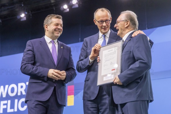 38th Federal Party Congress of the CDU of Germany in Stuttgart. Federal Chancellor Merz says goodbye to former Minister-President from Saxony-Anhalt, Reiner Haseloff. On the left, Sven Schulze. Stuttgart, Baden-Württemberg, Germany