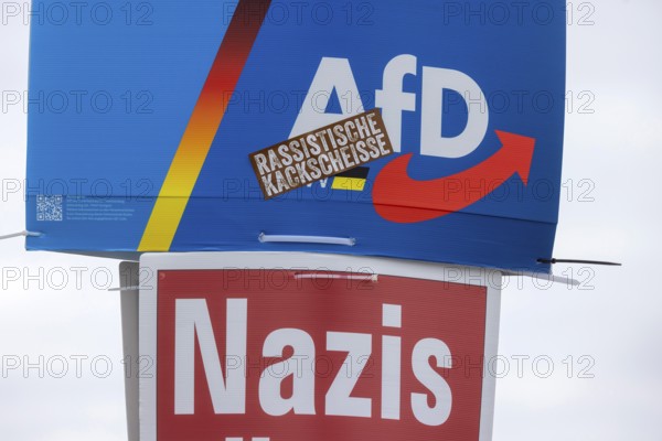 2026 state election in Baden-Württemberg. Election advertising in the city center of Stuttgart. Poster of the AfD party. Including a poster from THE PARTY THE PARTY with the slogan: Kill Nazis. Liver: Racist crap. Stuttgart, Baden-Württemberg, Germany