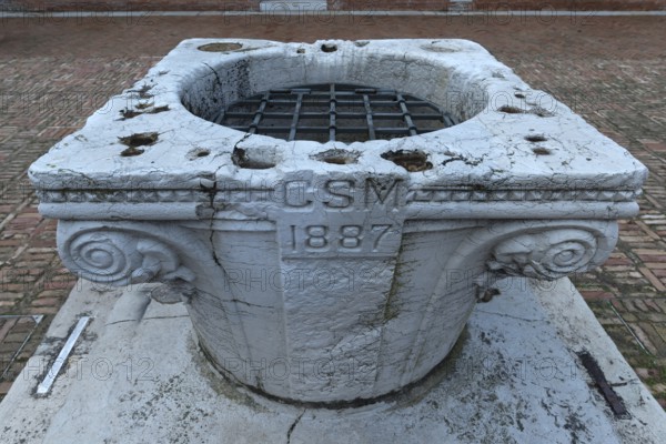 Historic fountain from 1887 in the courtyard of the cloister of the Madonna dell'Orto parish church, Venice, Veneto, Italy