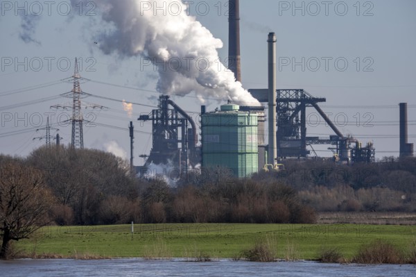 Backdrop of the HKM steelworks, Krupp-Mannesmann steel mill, blast furnaces, gasometer, coking plant extinguishing tower, fire cloud, North Rhine-Westphalia, Duisburg, Germany