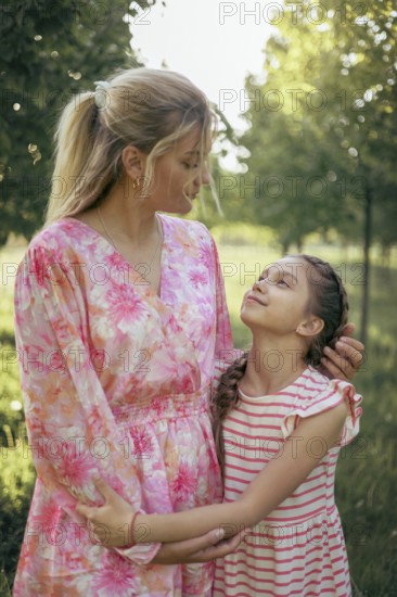A mother and her daughter gaze at each other with love and understanding in a sunlit park Their deep emotional bond is captured in a moment of trust, warmth, and closeness
