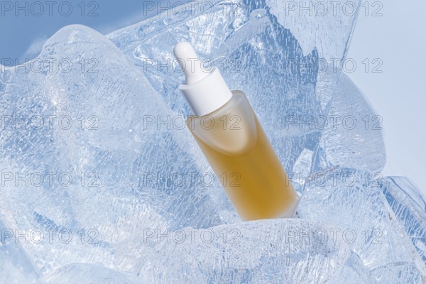 A skincare serum bottle nestled in sparkling clear ice, accentuating the concept of freshness and preservation in beauty products