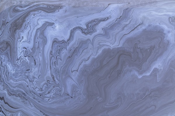 A detailed close up of abstract acrylic paint gray marble with swirling patterns. This intricate design conveys fluidity and elegance, perfect for backgrounds and modern designs