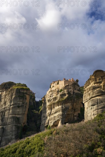 The ancient Varlaam Monastery sits atop towering rock formations at Meteora, Greece. A Unesco World Heritage site, this sacred location offers breathtaking views and dramatic natural beauty