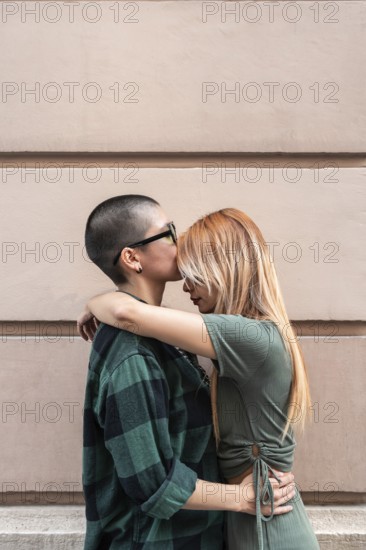 A tender moment between a Colombian lesbian couple, reflecting love and inclusivity. Embracing diversity and promoting LGBTQIA+ pride, respect, and equal rights
