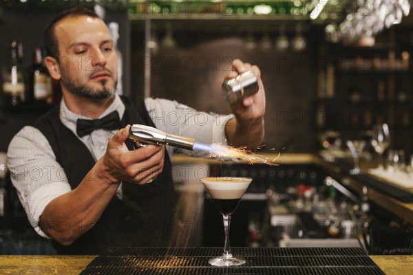 A skilled bartender carefully prepares a sophisticated cocktail at a trendy bar, showcasing expert technique and flair. The ambient setting enhances the engaging experience