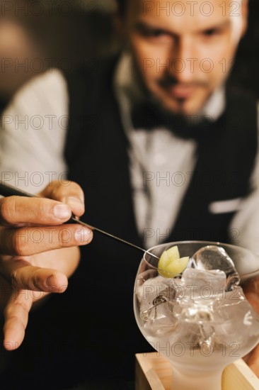 A professional bartender skillfully prepares a cocktail at an elegant bar. Focused on garnishing, showcasing expertise and passion in mixology. Captures ambiance and craftsmanship