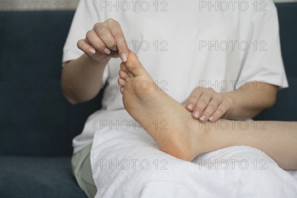 A mother and daughter relax at home, enjoying a self-care day together. They focus on wellness and bonding, enhancing their connection through nurturing activities