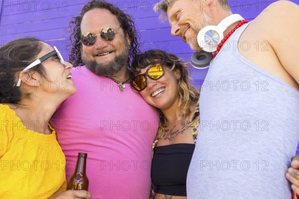 A joyful group of LGBTQIA+ friends sharing happiness, love, and diversity. They celebrate pride in a colorful setting, symbolizing unity and acceptance in the LGBTQIA+ community