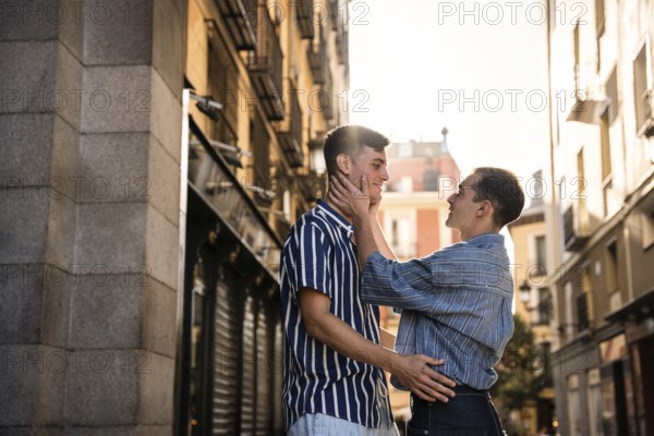 A gay couple shares a tender moment in the vibrant streets of Madrid. The warm light and intimate setting capture the essence of love and acceptance in this iconic city