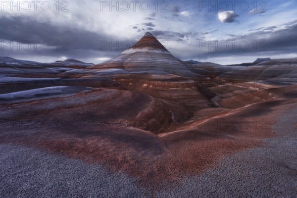 Striking Utah landscape showcasing colorful bentonite formations in Hanksville, creating an otherworldly scene with layered textures and dramatic skies, capturing nature's artistry