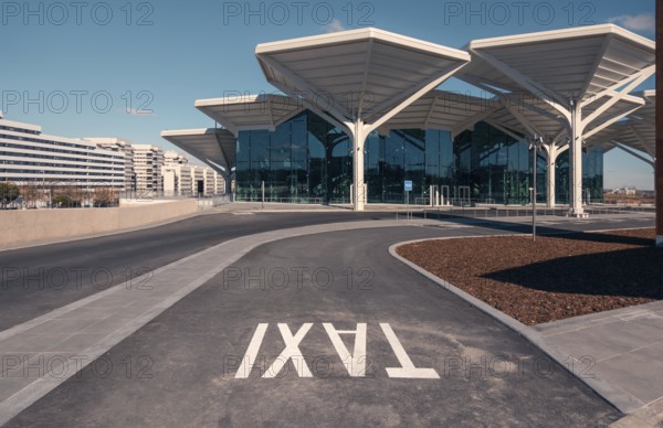 A spacious and modern transport hub in Valdebebas, Madrid, featuring a metro station, underground and suburban trains, and bus services, ensuring connectivity and convenience in urban transit