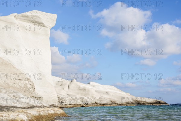 Breathtaking view of unique white rock formations against a clear blue sky at Sarakiniko on the island of Milos, Greece