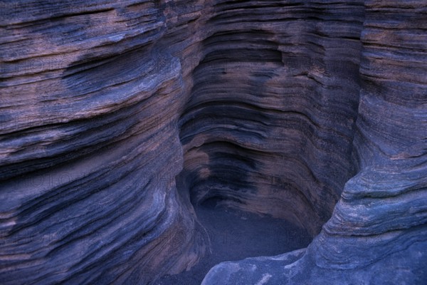 Intriguing photo capturing the detailed, layered rock formations inside Cueva de los Verdes on Lanzarote Island, showcasing the natural architectural beauty