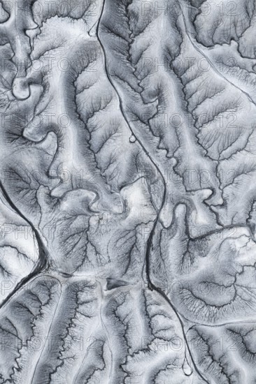 Captivating aerial shot of the unique, undulating terrain at Moonscape Overlook in Utah, showcasing nature's artistry in the intricate textures and patterns