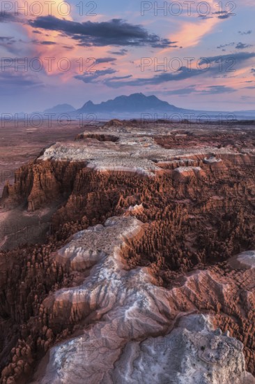 Striking aerial capture of Goblin Valley State Park in Utah, showcasing the rocky landscape bathed in the warm glow of sunset