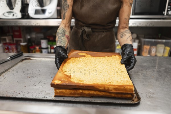 A baker in an Italian bakery handles freshly baked pastries The kitchen environment reflects traditional baking practices, highlighting artisanal craftsmanship