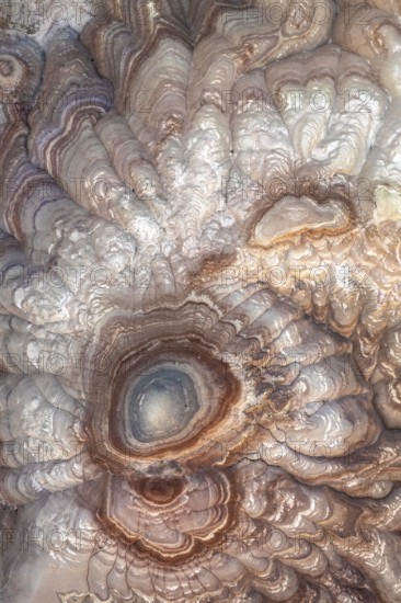 A stunning aerial view captures the intricate patterns and rich colors of bentonite sandstone in Utah, USA. Layers create a mesmerizing natural artwork from above