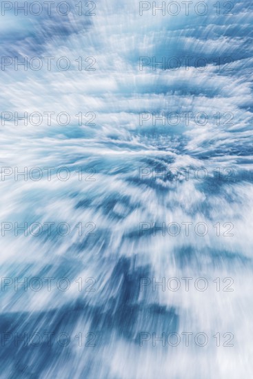 Blurred water effect creating a sense of speed and movement. The light reflections add a vibrant and abstract touch
