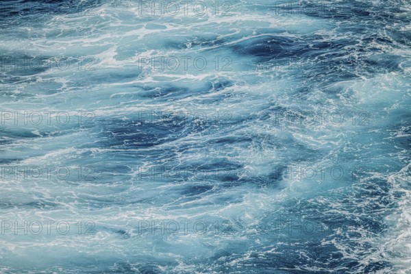 Calm water surface with soft ripples and shades of blue. A peaceful and serene moment of nature captured