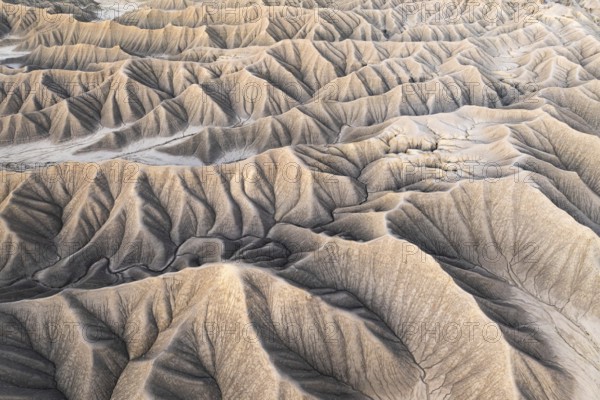 Aerial shot captures the intricate natural patterns and textures of Caineville Mesa near Hanksville in Utah, highlighting the unique geological formations