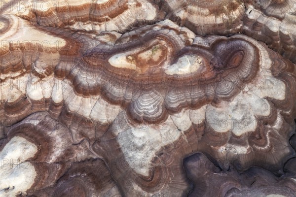 Aerial view highlights the intricate patterns and layers of bentonite-rich sandstone formations in Utah, USA, showcasing nature's artistry and geological wonders