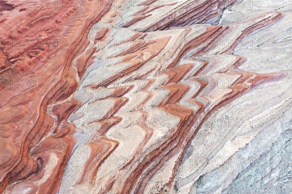 Colorful sediment patterns unfold in an aerial view of the canyon landscape near the San Juan River, showcasing Utah's unique geological beauty