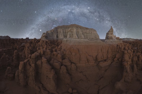 Majestic night sky filled with stars and the Milky Way above the unique sandstone formations of Goblin Valley State Park, Utah