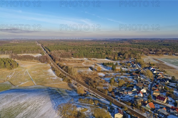 The Angermünde-Eberswallde railway line crosses the winter landscape in the UNESCO biosphere reserve Schorfheide-Chorin. Chorin, Barnim, Brandenburg, Germany
