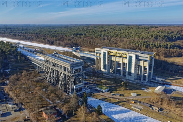 Niederfinow boat lift on the Oder-Havel Canal in winter with ice on the canal. aerial view. Niederfinow, Uckermark, Brandenburg, Germany