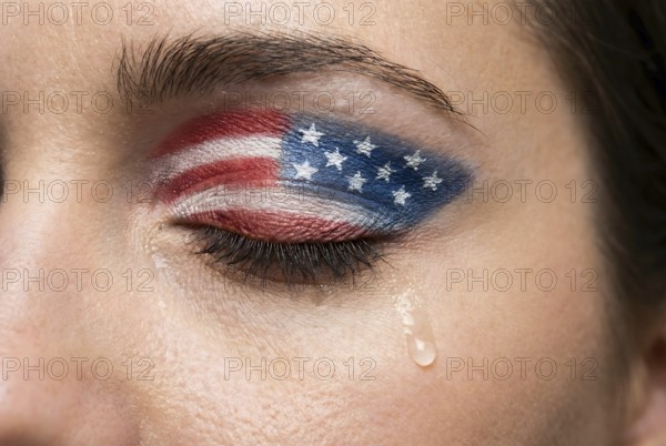 Close up of sad woman's eye with USA flag eyeshadow and tears representing political and social disillusionment. Generative AI, AI generated