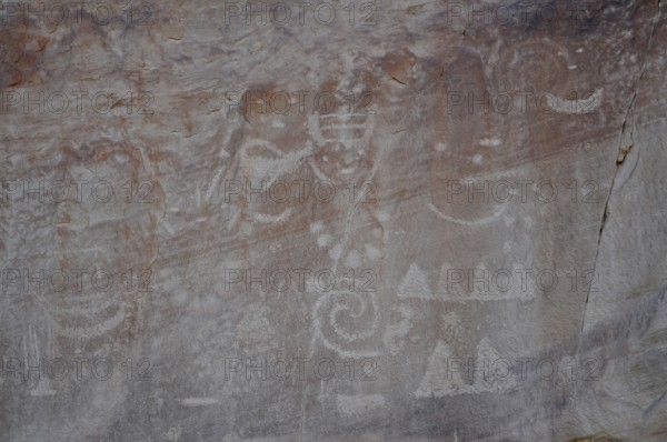 Ancient petroglyphs from the Fremont culture on a rock with mystical signs and symbols, Dinosaur National Monument, Utah, USA