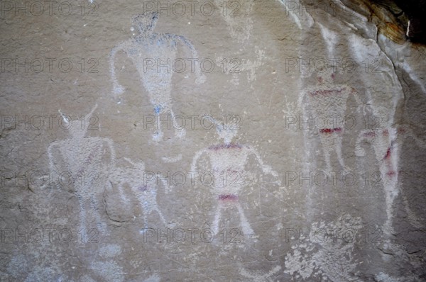 Historical art with human figures, petroglyphs from the Fremont culture, drawn on a rock wall, Dinosaur National Monument, Utah, USA