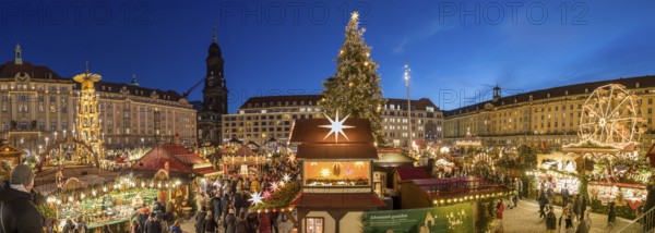 Panorama with Great Pyramid, Christmas Tree and Ferris Wheel at the Striezelmarkt Christmas Market on the Old Market Square in Dresden, with Kreuzkirche in the background, Saxony, Germany