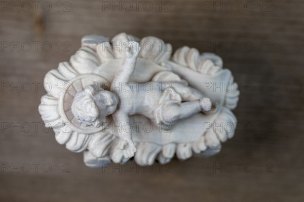 I'm standing at your crib here, wooden crib figure, the birth of Jesus Christ Child lying in a crib in a stable as a little Christ Child, Christmas