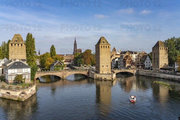The towers of the Ponts Couverts Covered Bridges on the Ill and the cathedral in Strasbourg, Alsace, France