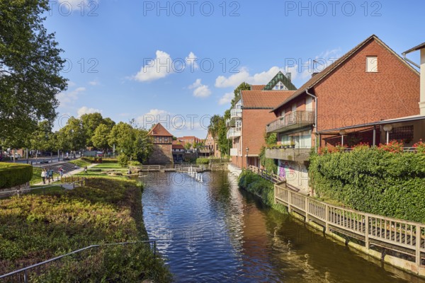 Mühlenstever, Stever river, residential buildings, brick buildings, houses, general architecture, trees, green area, lawn, paths, jetty, blue sky, cumulus clouds, Borgmühlenpättken, Lüdinghausen, Münsterland, Coesfeld district, North Rhine-Westphalia, Germany