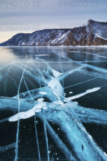 Lake Baikal is located in southern Siberia, Russia, near the city of Irkutsk. It is the deepest lake in the world, with a maximum depth of about 1, 642 meters (5, 387 feet), and the largest freshwater lake by volume, containing roughly 20% of the world's surface freshwater. Its surface area spans approximately 31, 500 km² (12, 200 sq mi). Baikal is a unique ecosystem, home to hundreds of endemic plant and animal species, including the famous Baikal seal, and plays a crucial role in the region's climate and biodiversity. Due to its outstanding natural significance, it was designated a UNESCO World Heritage Site in 1996