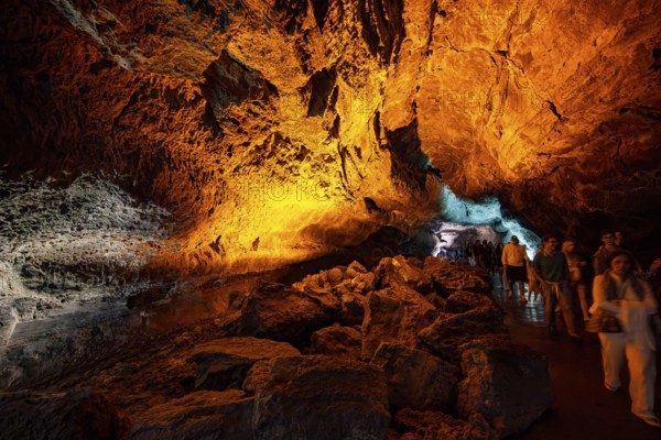 Underground cave formed by lava flow, visitors illuminated lava cave, Cueva de los Verdes, Lanzarote, Canary Islands, Spain