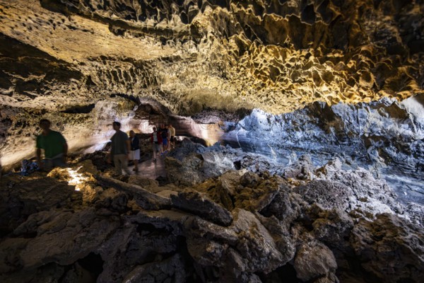 Underground cave formed by lava flow, visitors in illuminated lava cave, Cueva de los Verdes, Lanzarote, Canary Islands, Spain