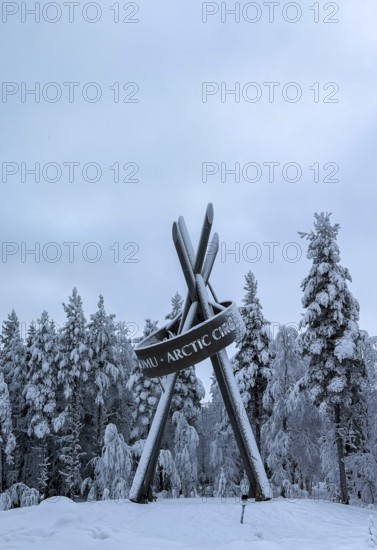 Monument on polar ice, snowy forest, Lapland, Finland