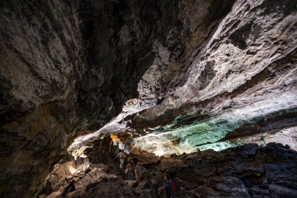 Underground cave formed by lava flow, visitors in illuminated lava cave, Cueva de los Verdes, Lanzarote, Canary Islands, Spain