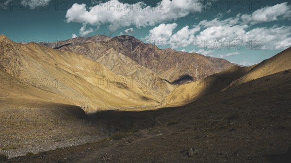 Barren mountain landscape with shade and blue sky, trekking in Ladakh, Stok la, Himalayas, India