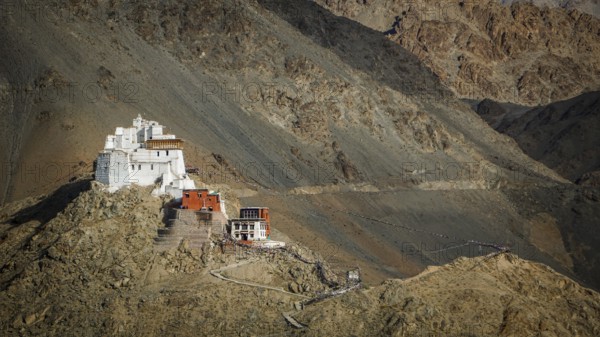 Namgyal Tsemo Buddhist monastery nestled in the barren mountains on a escarpment, Leh, trekking in Ladakh, Stok la, Himalayas, India