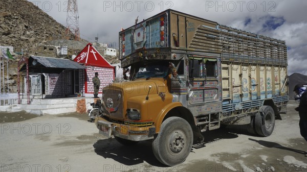 A colorful Indian truck at Kardung-La Pass, trekking in Ladakh, Himalayas, India